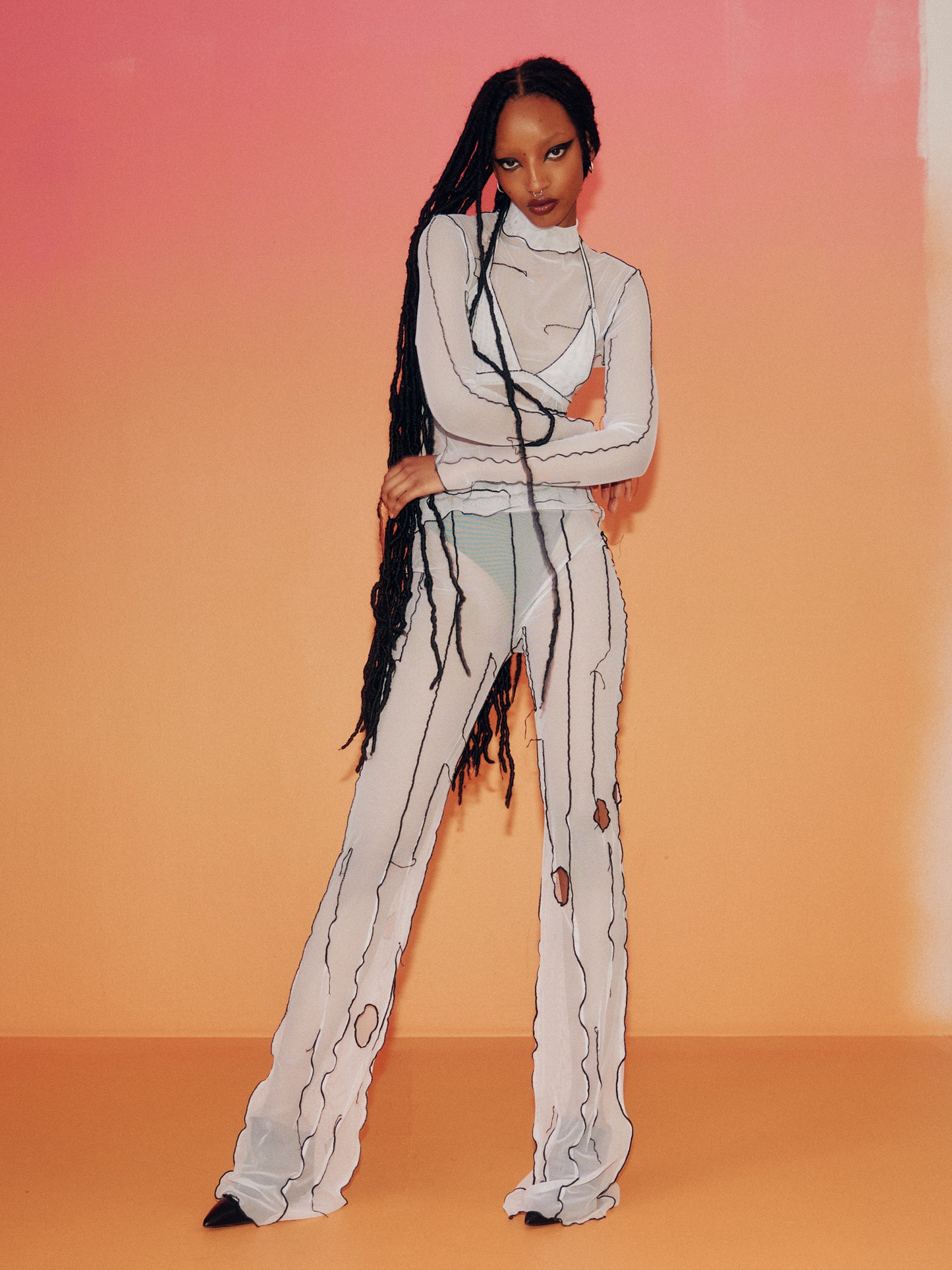 Pantalon évasé en filet blanc
