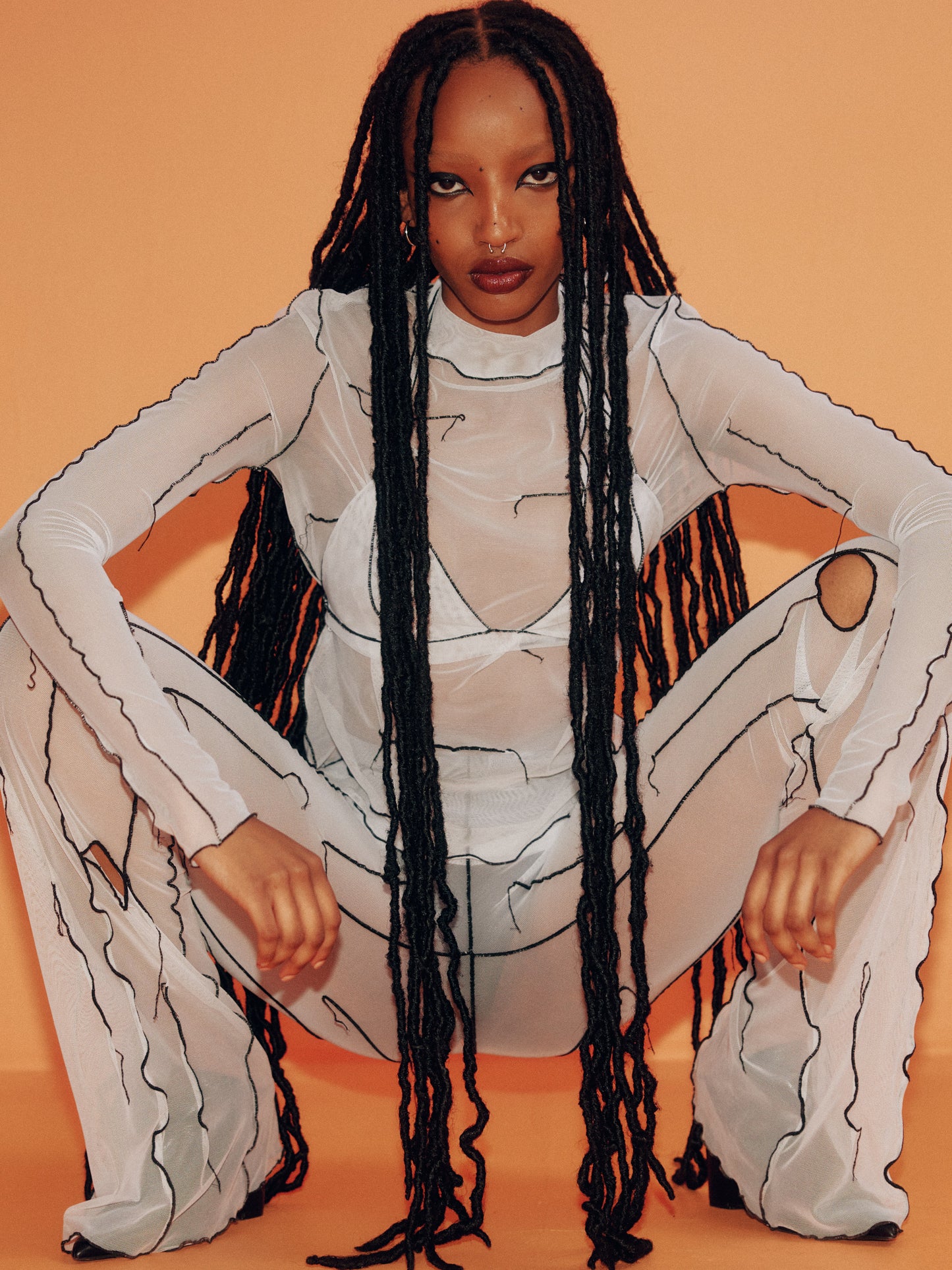 Pantalon évasé en filet blanc
